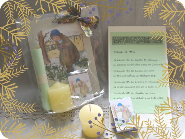 Geschenkig verpackte Faltkarte mit einem frierenden Kind, das sich an einer Christrose freut, dazu eine Kerze, Streichhölzer mit dem Christrosen-Motiv und ein Wünsche-Text.